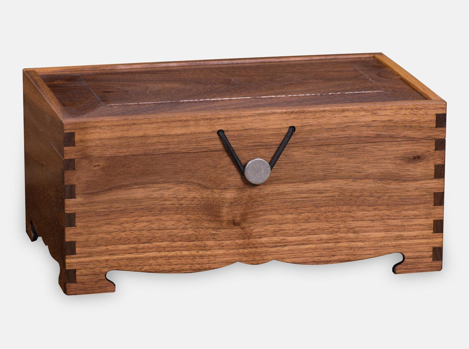 Wooden Cremation Urn. Black Walnut wood. Box joint construction. Environment friendly oil finish. Laser engraving. Hinged with pewter button closure. Made by Quintessential Canada Inc.
